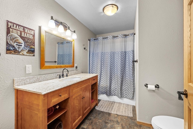 1808 28th St, Minot, ND 58703 - bathroom featuring vanity and a textured wall