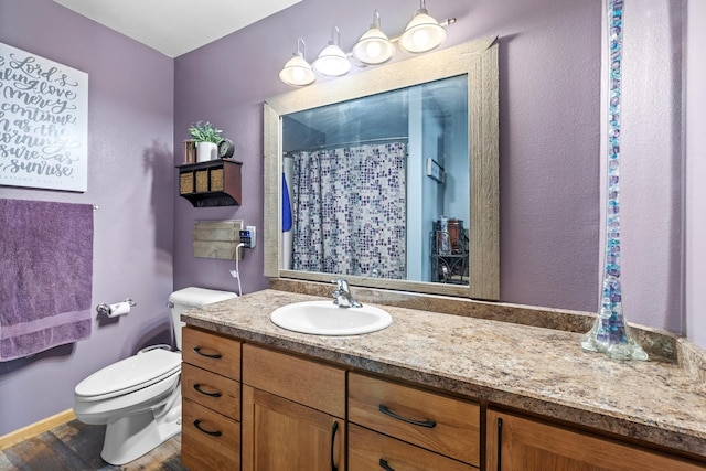 1808 28th St, Minot, ND 58703 - full bath with vanity, wood finished floors, and a shower with shower curtain