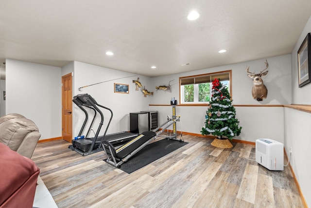 1808 28th St, Minot, ND 58703 - exercise area with light wood-type flooring and recessed lighting