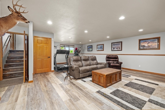 1808 28th St, Minot, ND 58703 - living room featuring light wood-style floors, recessed lighting, and stairway