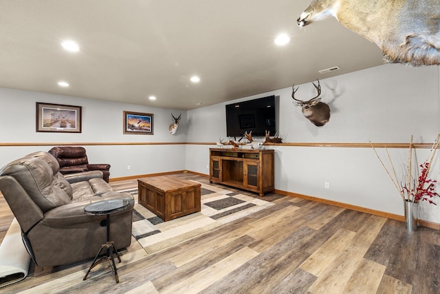 1808 28th St, Minot, ND 58703 - living room featuring light wood-type flooring and recessed lighting