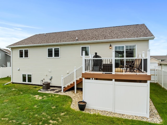 1808 28th St, Minot, ND 58703 - back of property with a deck, stairway, and roof with shingles