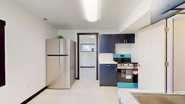 1113 10th St, Minot, ND 58703 - kitchen with appliances with stainless steel finishes, light countertops, and light floors