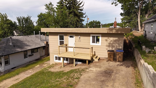 1113 10th St, Minot, ND 58703 - view of front of house with a wooden deck