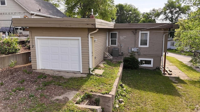 1113 10th St, Minot, ND 58703 - view of side of property with a chimney and a lawn