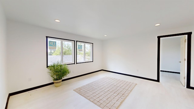 1113 10th St, Minot, ND 58703 - empty room with recessed lighting and wood finished floors