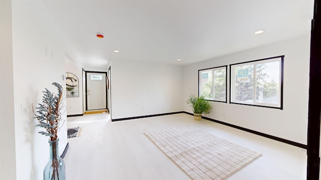 1113 10th St, Minot, ND 58703 - unfurnished room featuring recessed lighting and light wood-style floors