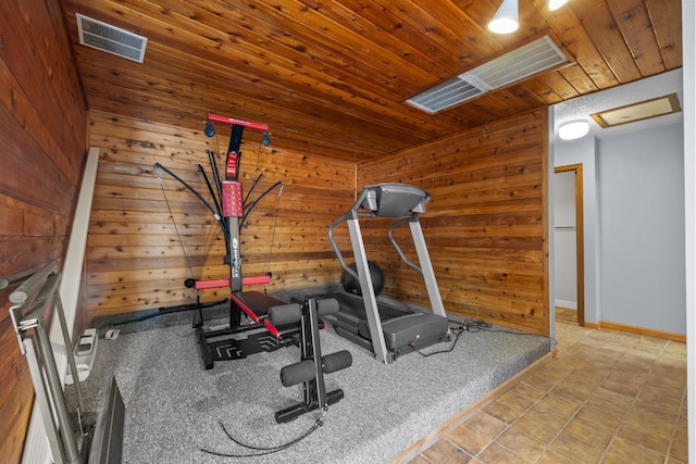 606 19th Ave Unit 7, Minot, ND 58701 - workout area featuring wood walls and wooden ceiling