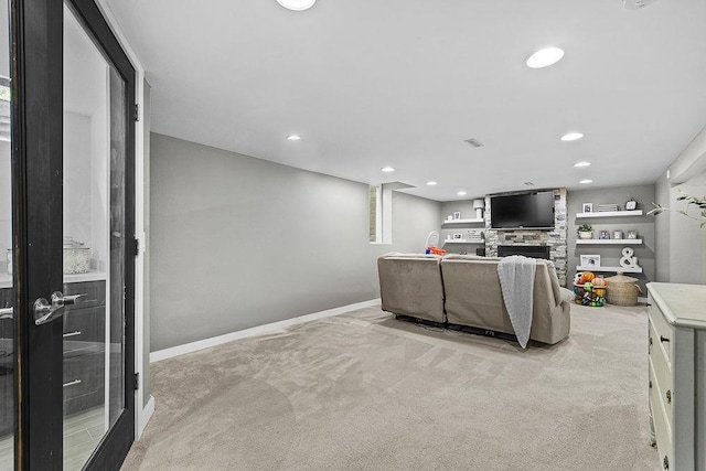 120 25th St, Minot, ND 58701 - living room with carpet, a fireplace, and recessed lighting