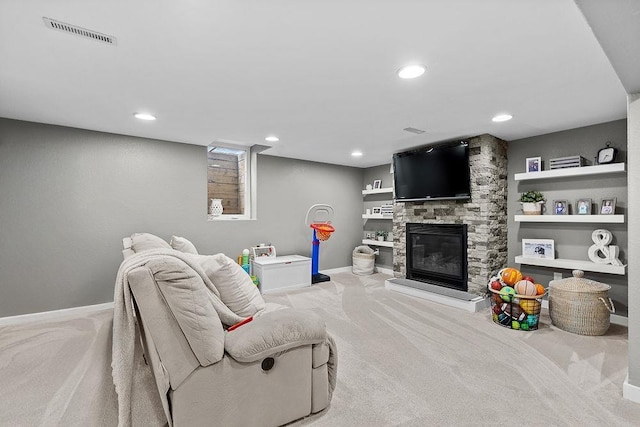 120 25th St, Minot, ND 58701 - carpeted living area with a fireplace and recessed lighting