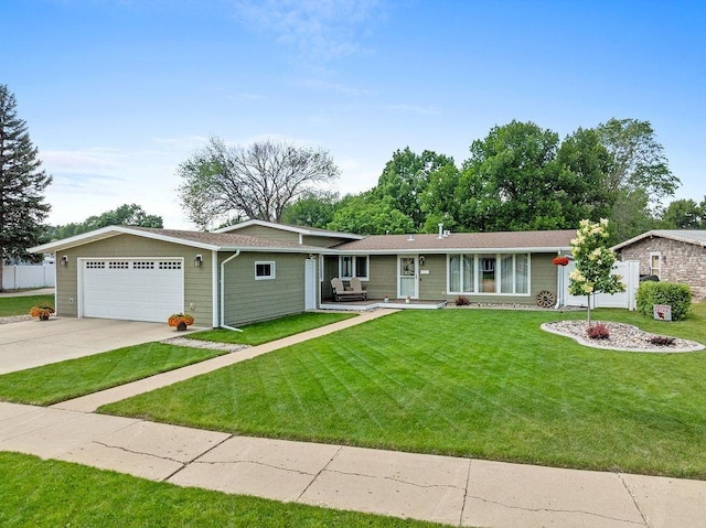 120 25th St, Minot, ND 58701 - ranch-style house with a garage and concrete driveway