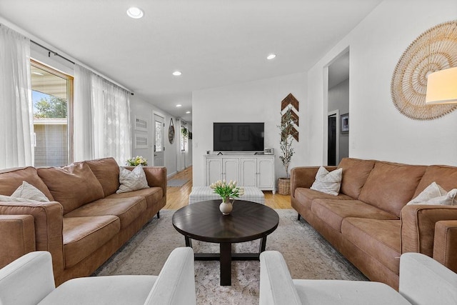 120 25th St, Minot, ND 58701 - living area with light wood-style floors and recessed lighting