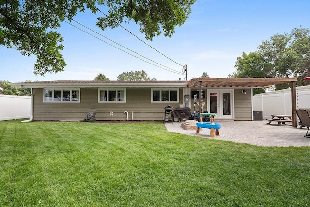 120 25th St, Minot, ND 58701 - rear view of property featuring a fenced backyard and a patio area