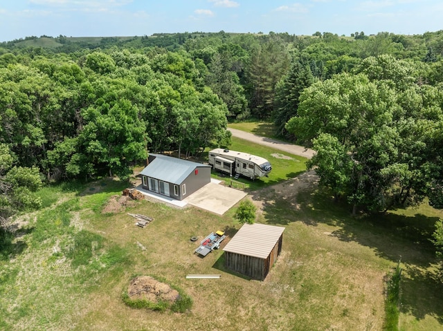 4706 SE 37th St, Minot, ND 58701 - aerial view of property and surrounding area featuring a forest
