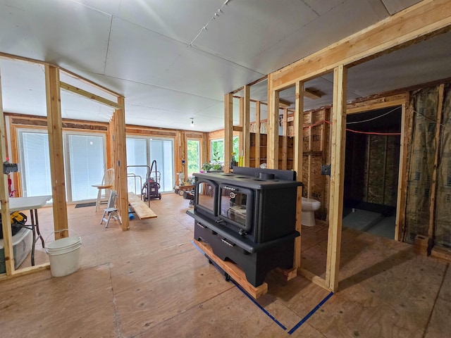 4706 SE 37th St, Minot, ND 58701 - below grade area featuring a wood stove