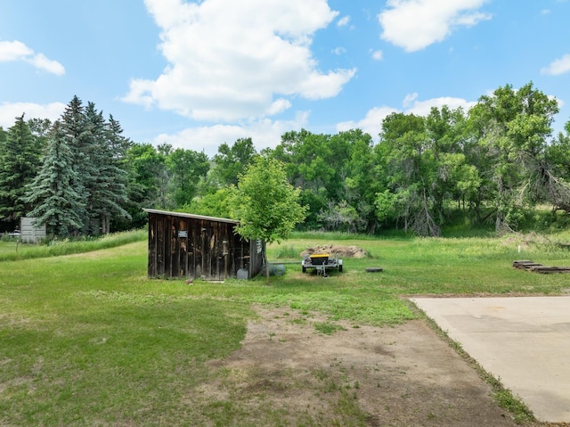 4706 SE 37th St, Minot, ND 58701 - view of green lawn featuring an outdoor structure