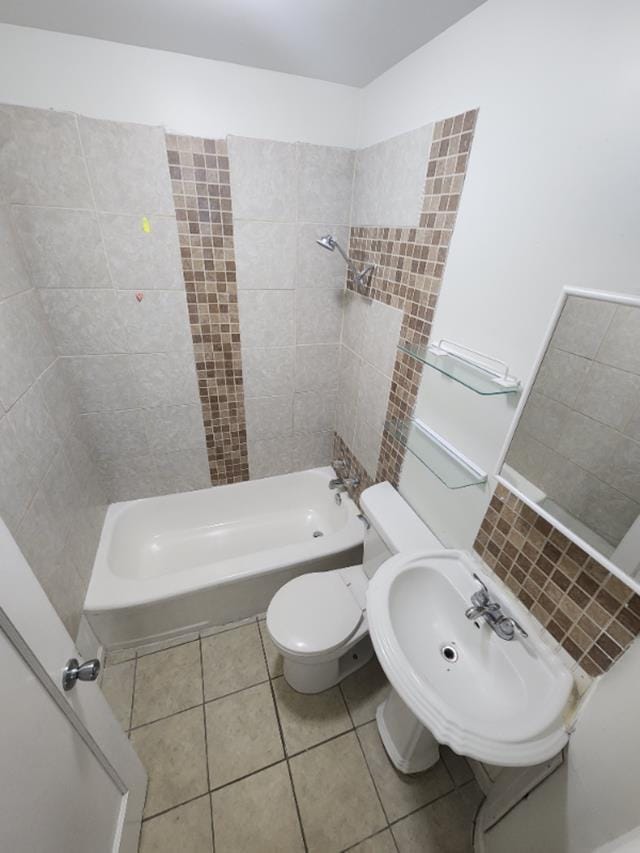 607 Main St, Minot, ND 58701 - bathroom with tile patterned floors and shower / bathtub combination