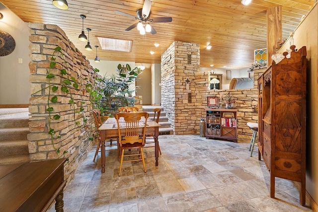 309 4th Ave, Mohall, ND 58761 - dining room with wooden ceiling, a ceiling fan, stone finish flooring, and stairway