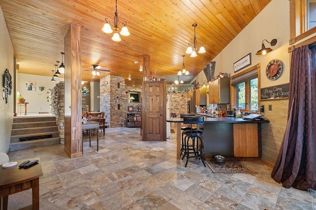 309 4th Ave, Mohall, ND 58761 - kitchen featuring a chandelier, stone tile flooring, dark countertops, and wooden ceiling