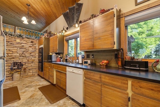 309 4th Ave, Mohall, ND 58761 - kitchen with white dishwasher, dark countertops, stainless steel microwave, brown cabinets, and wooden ceiling
