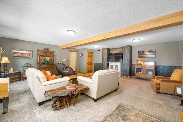 309 4th Ave, Mohall, ND 58761 - living room featuring carpet flooring, a textured ceiling, and beamed ceiling