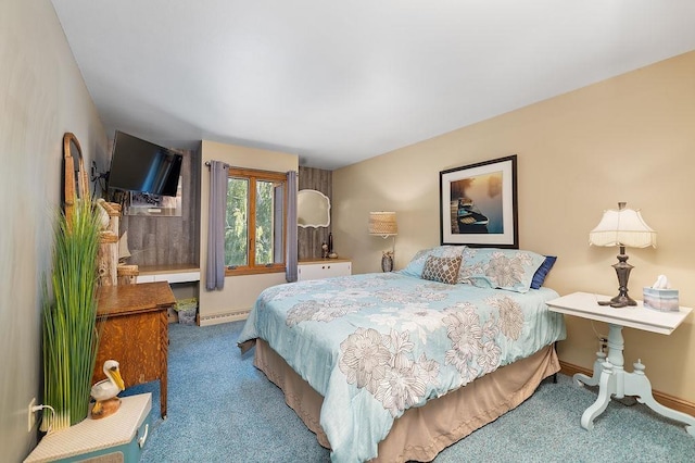 309 4th Ave, Mohall, ND 58761 - carpeted bedroom featuring baseboards and a baseboard heating unit