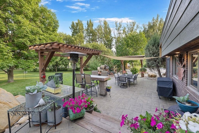 309 4th Ave, Mohall, ND 58761 - view of patio featuring a pergola, a grill, and outdoor dining area
