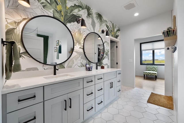 2415 43rd Ave, Minot, ND 58701 - bathroom featuring double vanity, tile patterned floors, and recessed lighting