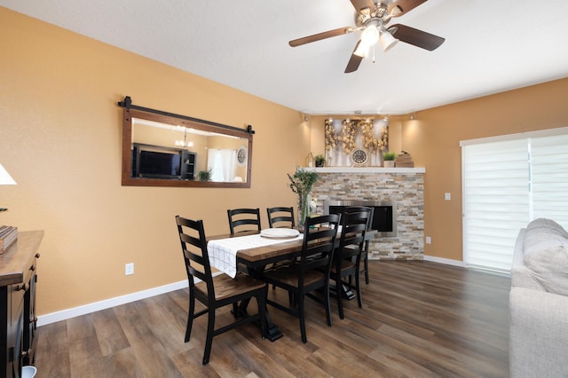 4007 Crossing St, Minot, ND 58701 - dining room with wood finished floors, a fireplace, and ceiling fan
