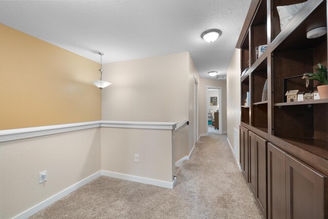4007 Crossing St, Minot, ND 58701 - corridor featuring light colored carpet and baseboards
