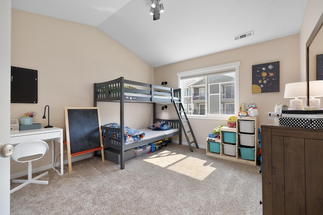 4007 Crossing St, Minot, ND 58701 - carpeted bedroom featuring lofted ceiling and baseboards