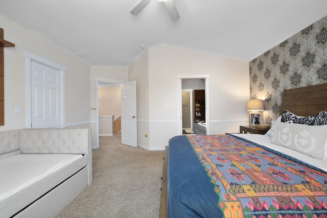 4007 Crossing St, Minot, ND 58701 - bedroom with light colored carpet, lofted ceiling, and ceiling fan