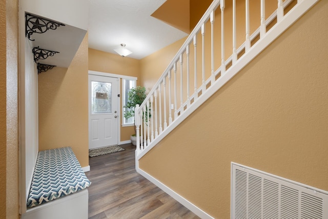 4007 Crossing St, Minot, ND 58701 - entryway with wood finished floors and stairs