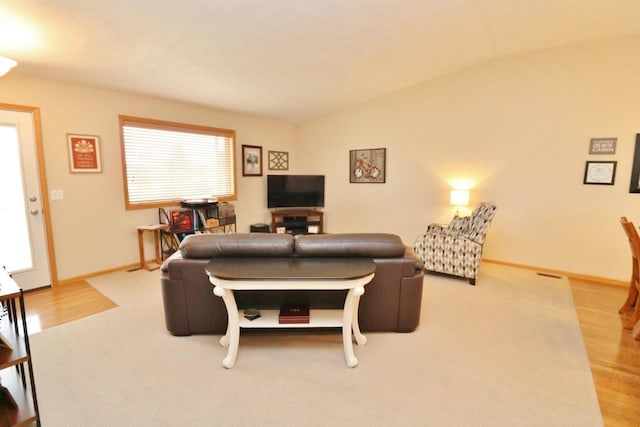 2033 14th St, Minot, ND 58703 - living area with vaulted ceiling and wood finished floors