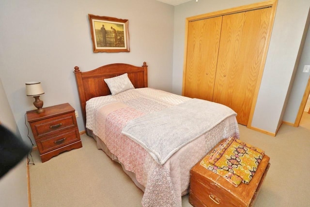 2033 14th St, Minot, ND 58703 - bedroom featuring light colored carpet and a closet