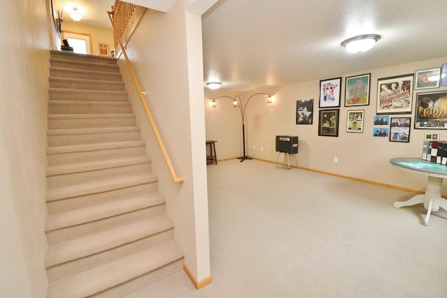 2033 14th St, Minot, ND 58703 - stairway featuring carpet and a textured ceiling
