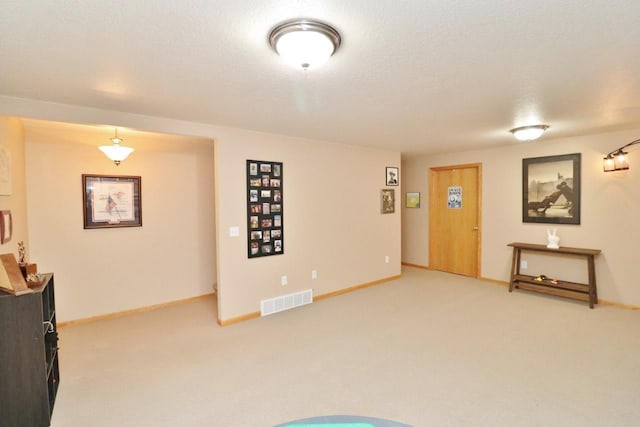 2033 14th St, Minot, ND 58703 - living area with light carpet and a textured ceiling