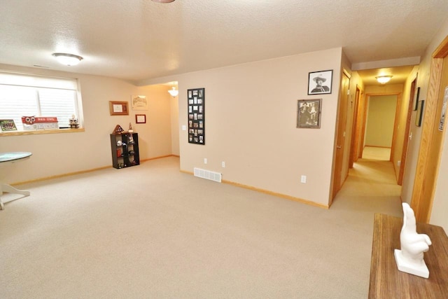 2033 14th St, Minot, ND 58703 - basement with a textured ceiling and light carpet