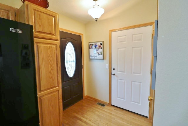 2033 14th St, Minot, ND 58703 - foyer entrance featuring light wood-style flooring