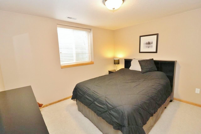 2033 14th St, Minot, ND 58703 - bedroom featuring carpet flooring and baseboards