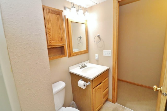 2033 14th St, Minot, ND 58703 - bathroom with vanity and toilet
