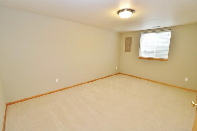 2033 14th St, Minot, ND 58703 - carpeted spare room featuring electric panel and baseboards