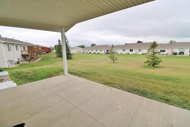 2033 14th St, Minot, ND 58703 - view of patio with a residential view, a deck, and stairway