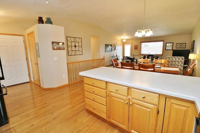 2033 14th St, Minot, ND 58703 - kitchen with light wood-style floors, a chandelier, light countertops, decorative light fixtures, and open floor plan