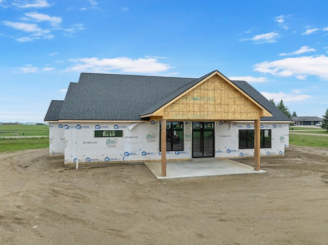 2610 43rd Ave, Minot, ND 58701 - back of house with roof with shingles