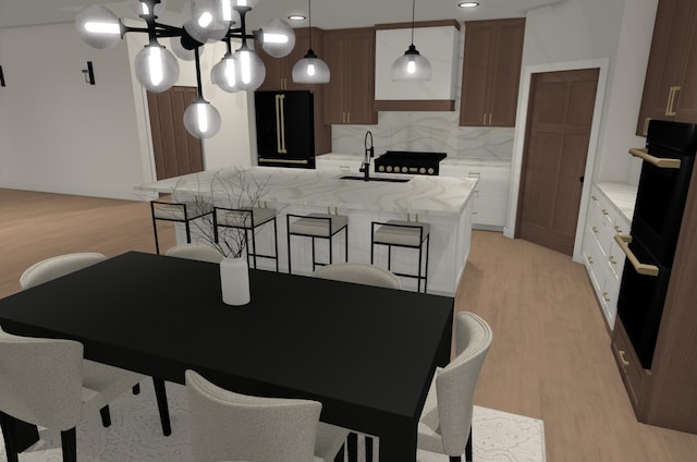 2610 43rd Ave, Minot, ND 58701 - dining room featuring light wood-style floors and a chandelier