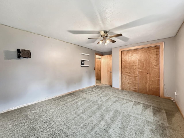 1434 10th St, Minot, ND 58701 - unfurnished bedroom featuring carpet flooring, a closet, and ceiling fan
