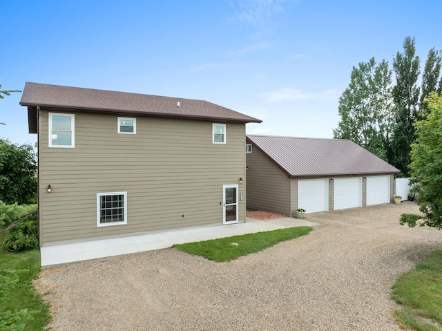 4610 12d St NW, Garrison, ND 58540 - back of house featuring a garage