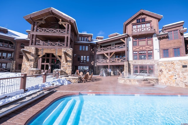 view of snow covered pool