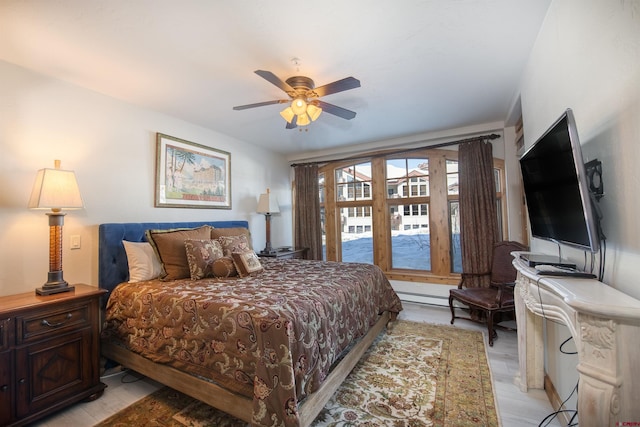 bedroom featuring light hardwood / wood-style floors and ceiling fan